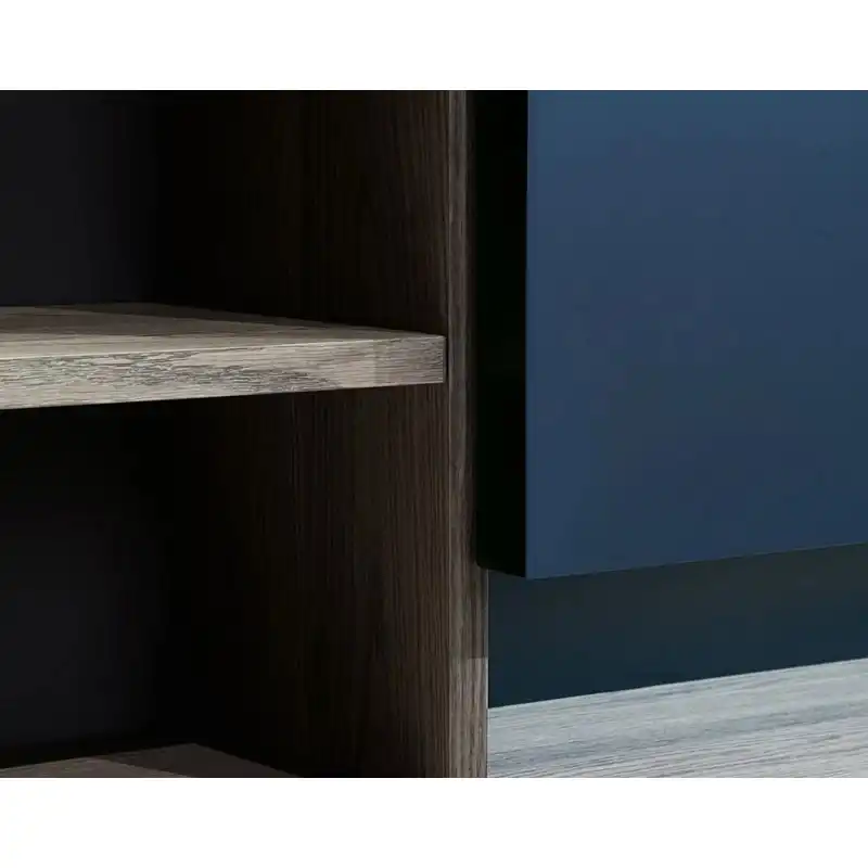 Modern Minimalist Home Office with Floor-to-Ceiling Modular Bookshelf Wall and Blue Accent Panel