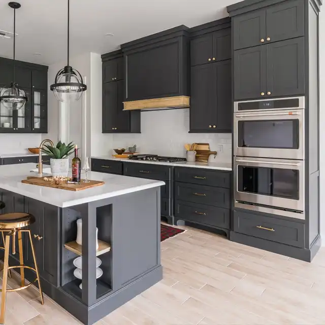 Modern Kitchen with Dark Gray Cabinetry, Brass Hardware and Central Island Design
