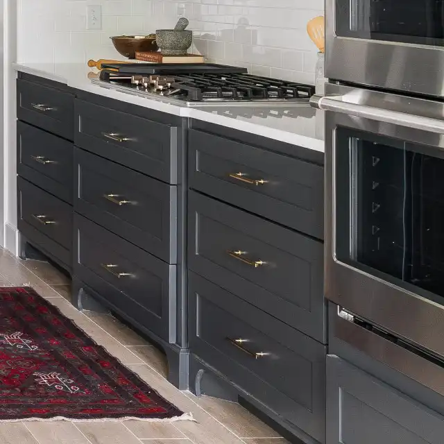 Modern Kitchen with Dark Gray Cabinetry, Brass Hardware and Central Island Design