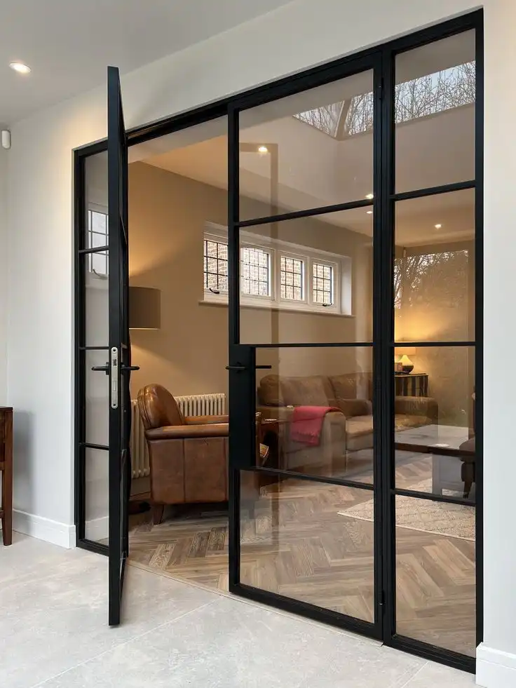 Modern Industrial Interior French Doors with Black Metal Frames and Glass Panels