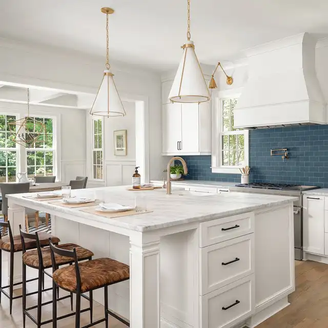 Bright White Kitchen with Navy Blue Backsplash and Central Island Design