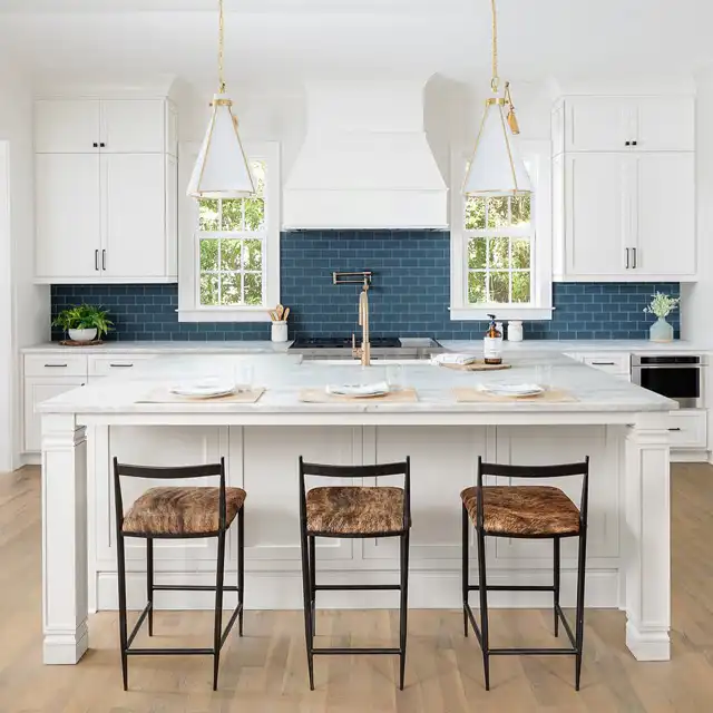 Bright White Kitchen with Navy Blue Backsplash and Central Island Design