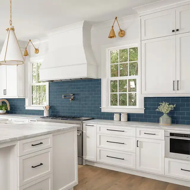 Bright White Kitchen with Navy Blue Backsplash and Central Island Design