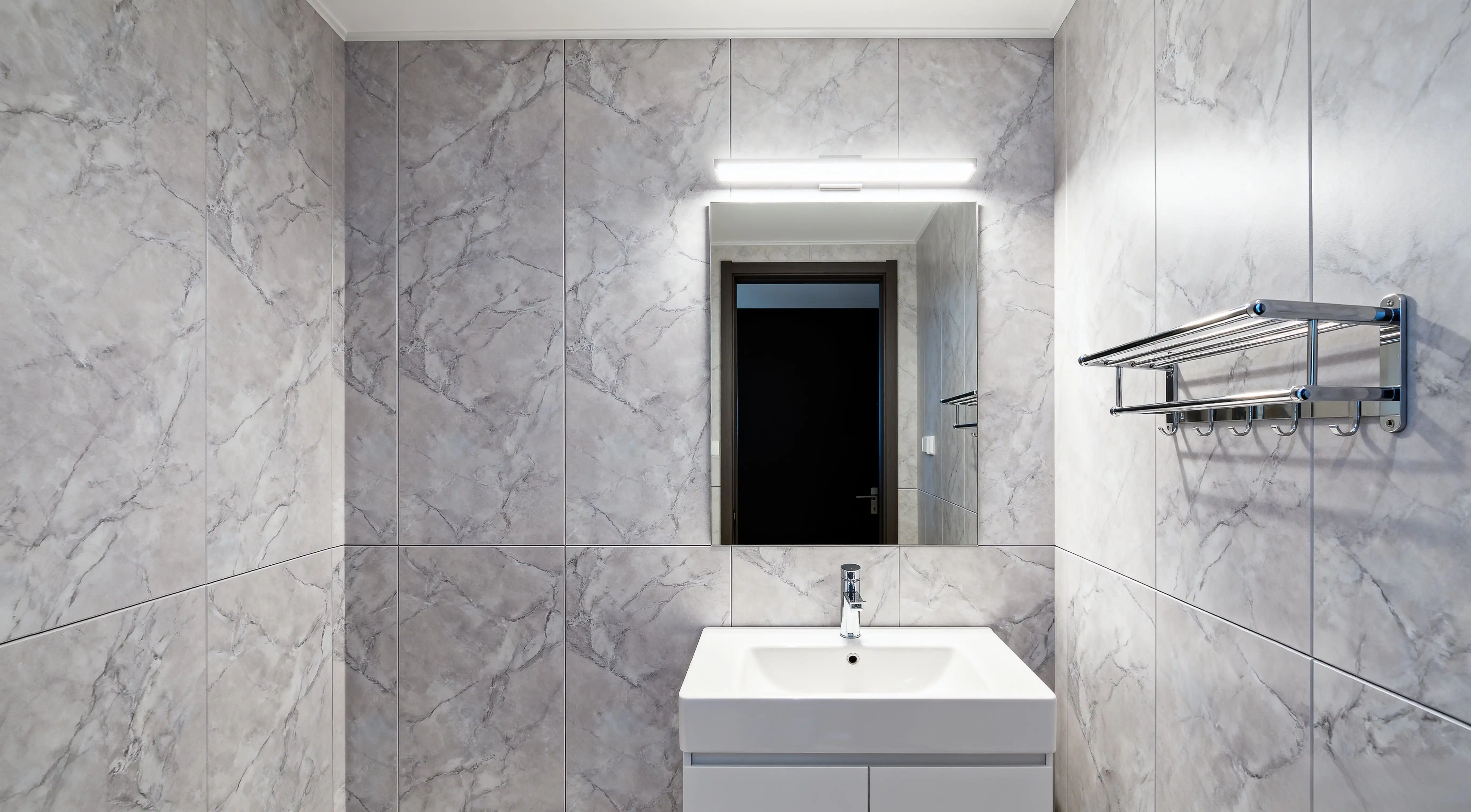 Modern Bathroom with Light Gray Marble Texture Wall Panels and LED Mirror