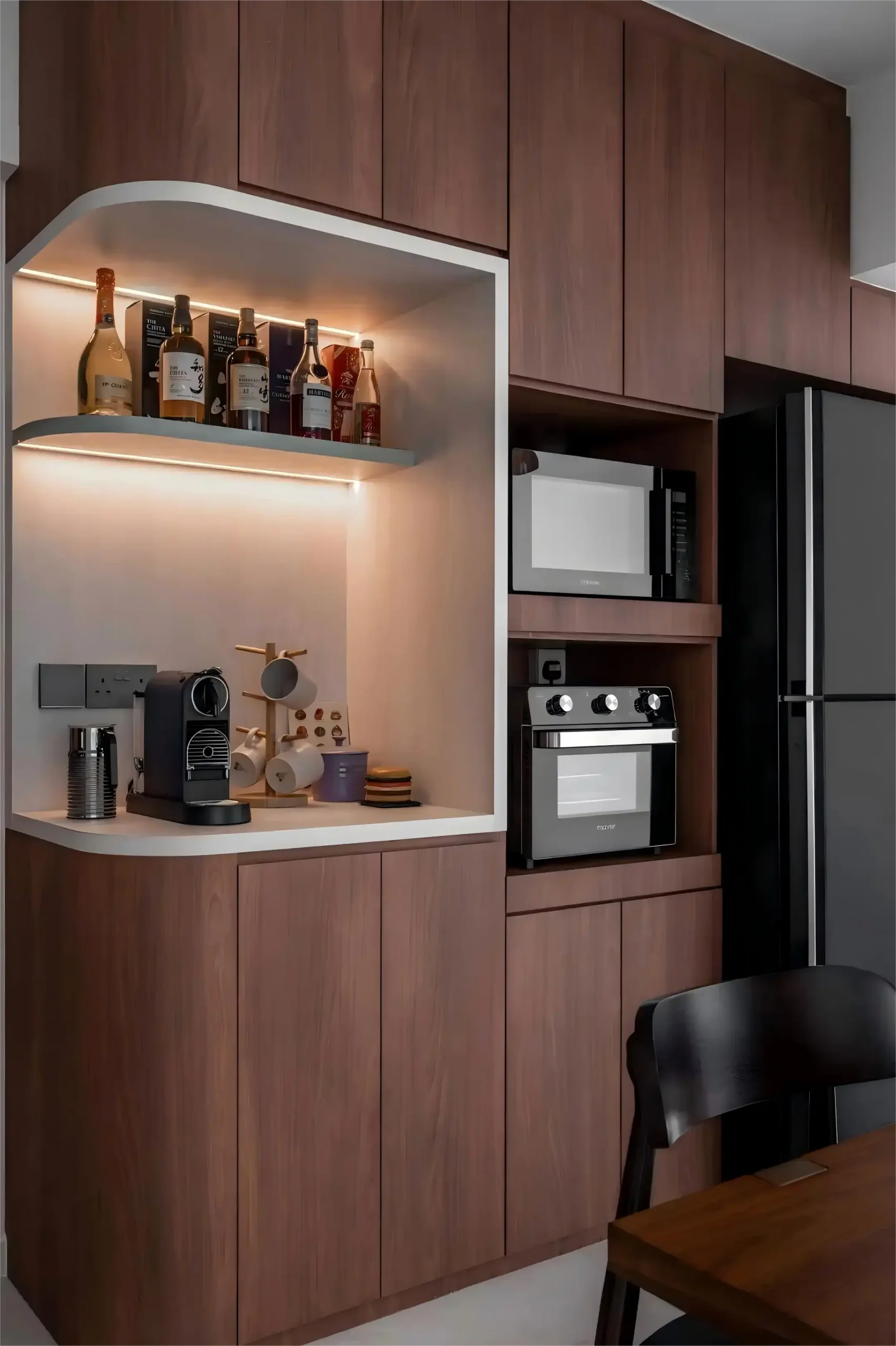 Modern walnut wood dining room cabinet with LED-lit liquor display shelf, integrated microwave niche, and coffee station in contemporary kitchen-dining space