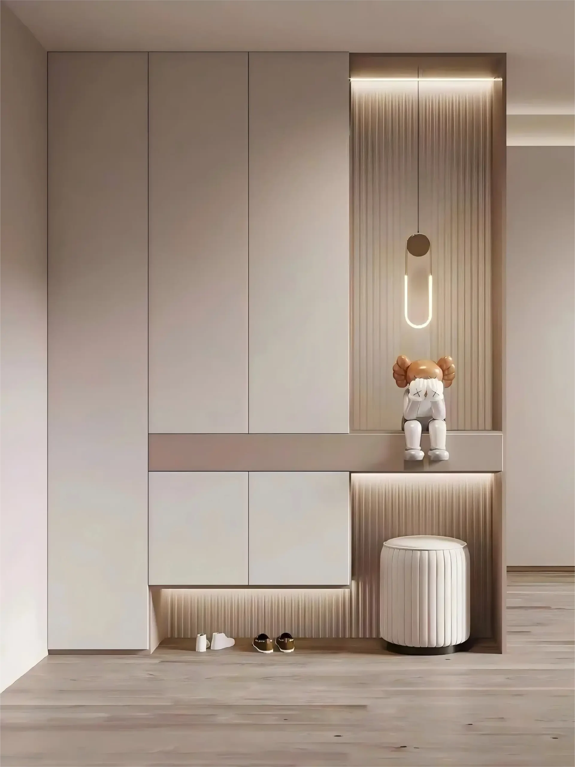 Modern entryway cabinet with vertical striped panel, U-shaped pendant light, and decorative cartoon figurine