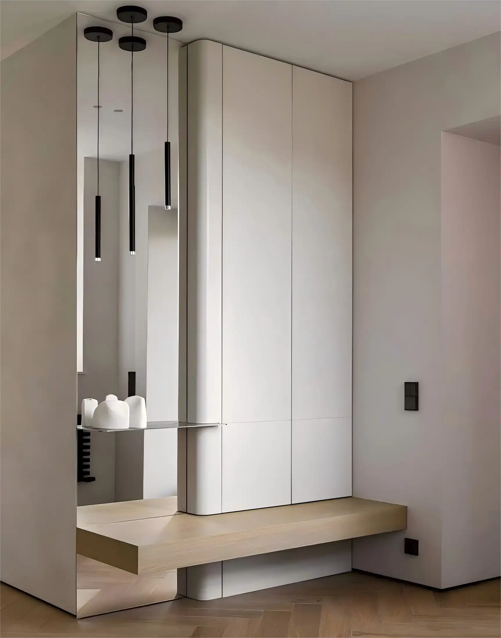 Minimalist entryway cabinet with full-length mirror, wooden bench, and black pendant lights in white finish
