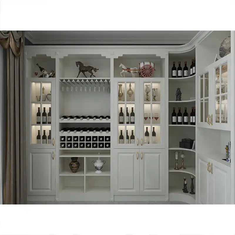 Elegant white wooden wine cabinet with glass doors, brass hardware, wine bottle storage racks, and decorative display shelves in luxury home interior