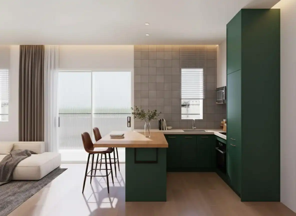 Modern dark green kitchen with a small kitchen island featuring a wooden countertop and two brown bar stools, set against a backdrop of light gray square tiles and a sliding glass door.