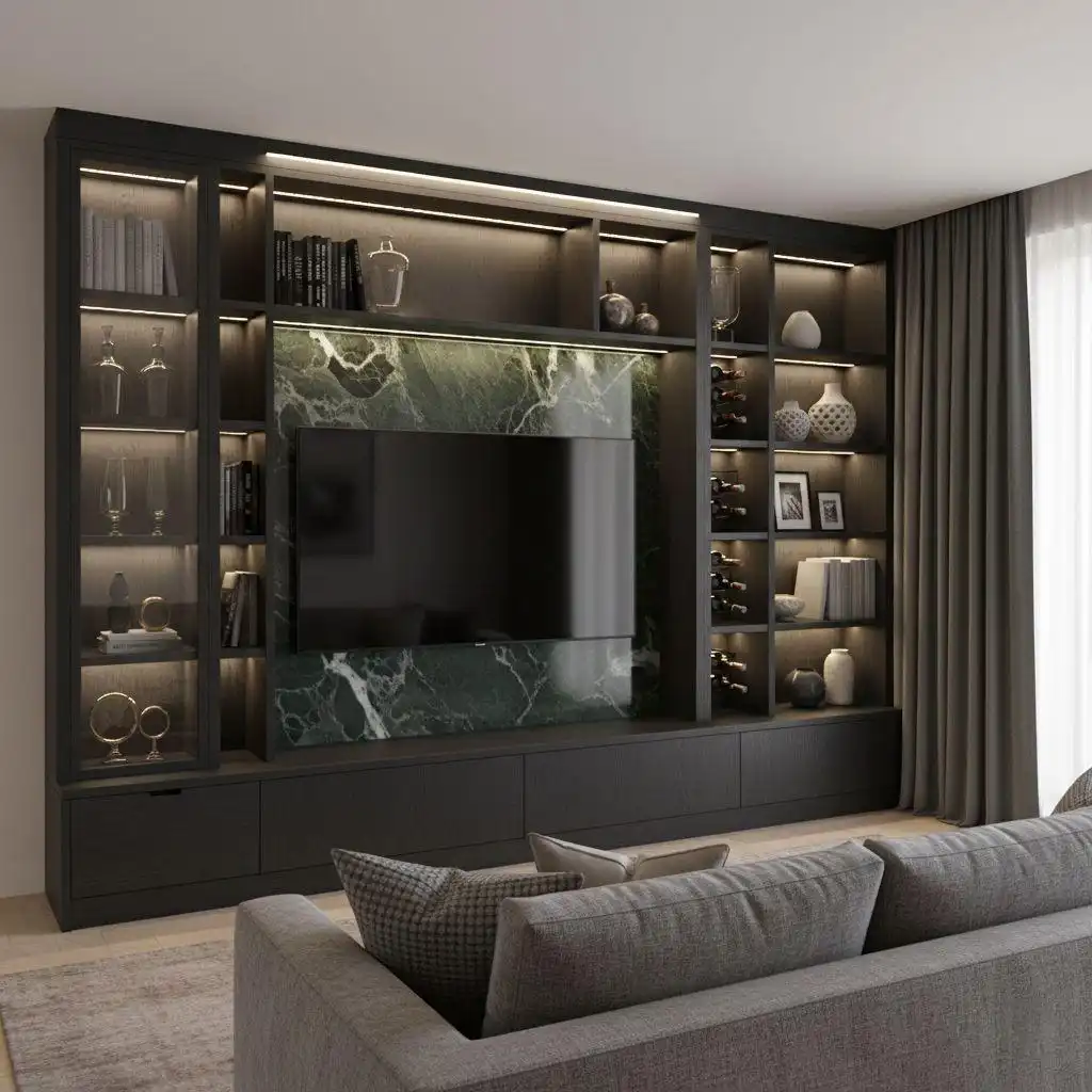 A luxury bespoke built-in TV wall unit with dark charcoal wood finish, integrated wine bottle storage, illuminated open shelving, and a striking emerald green marble backsplash.
