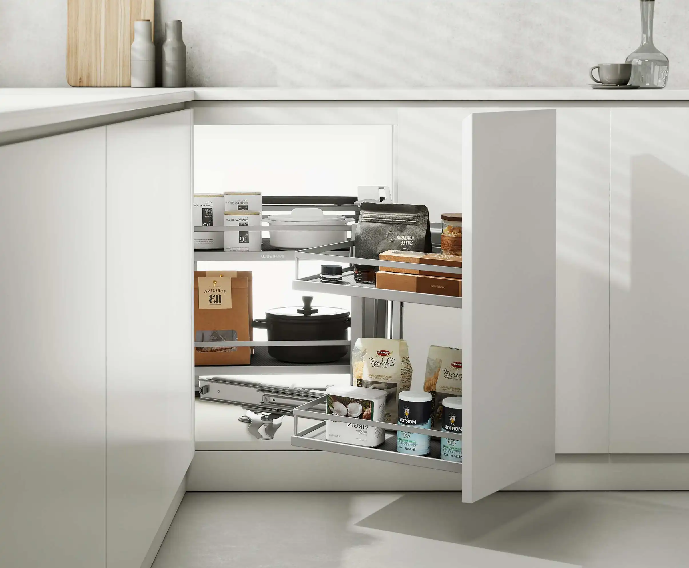 L shaped kitchen corner solutions 3 A two-tier dark grey LeMans-style swivel organizer inside a black L-shaped corner cabinet, holding pots, jars, and food bags.