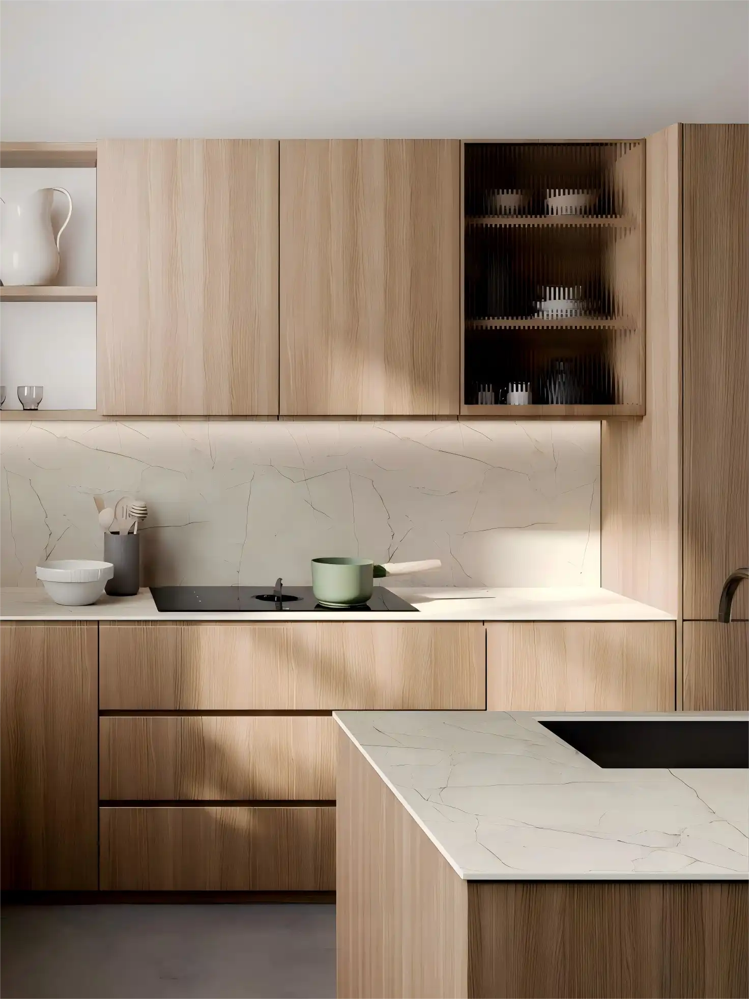 Particle Board Kitchen Cabinets: A bright, minimalist kitchen with matte white cabinetry, black pull handles, white subway tile backsplash, and a large central island with a marble countertop and four black bar stools.