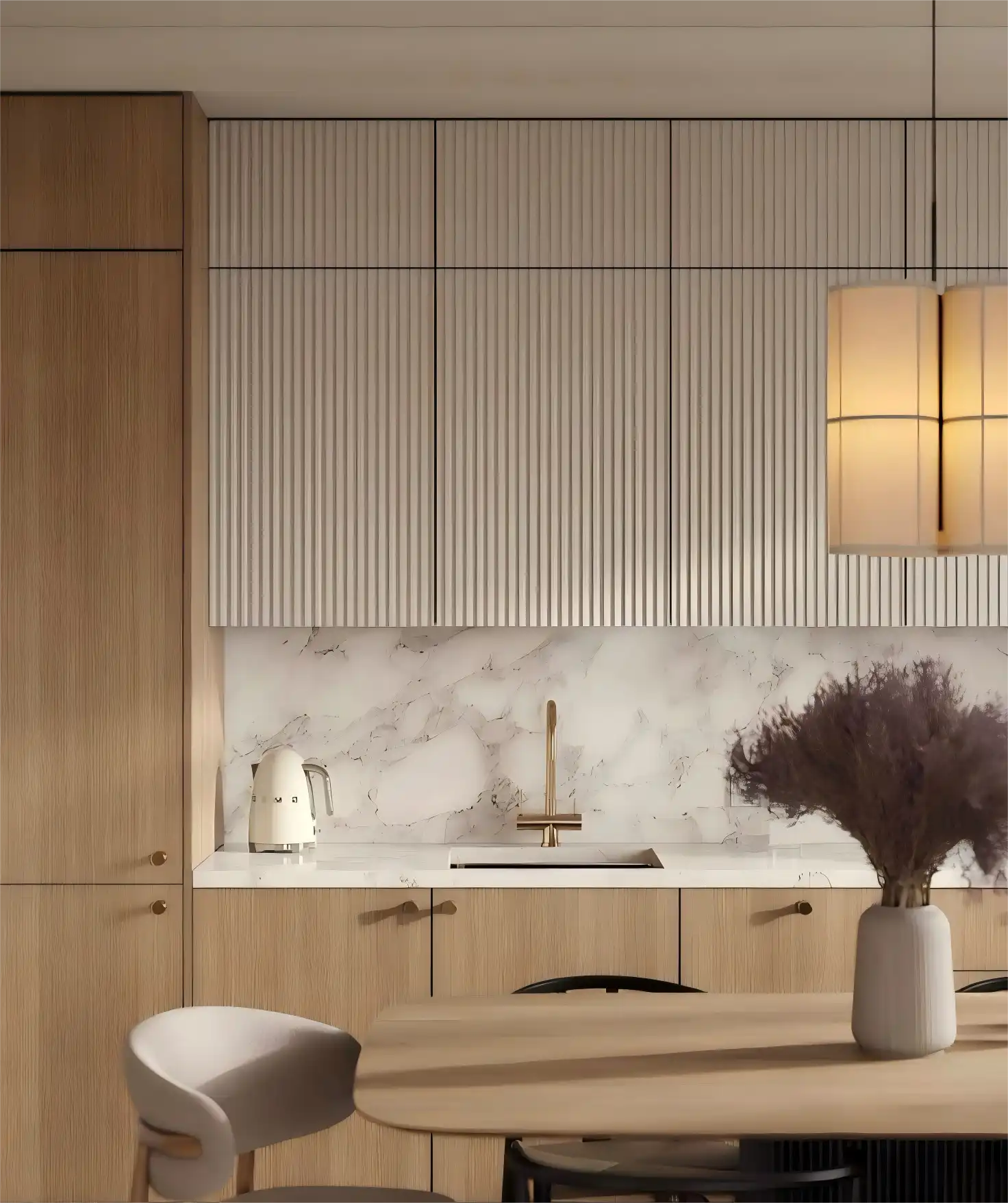 Modern kitchen with light oak fluted kitchen cabinets above a white marble backsplash, brass faucet, and minimalist dining area.