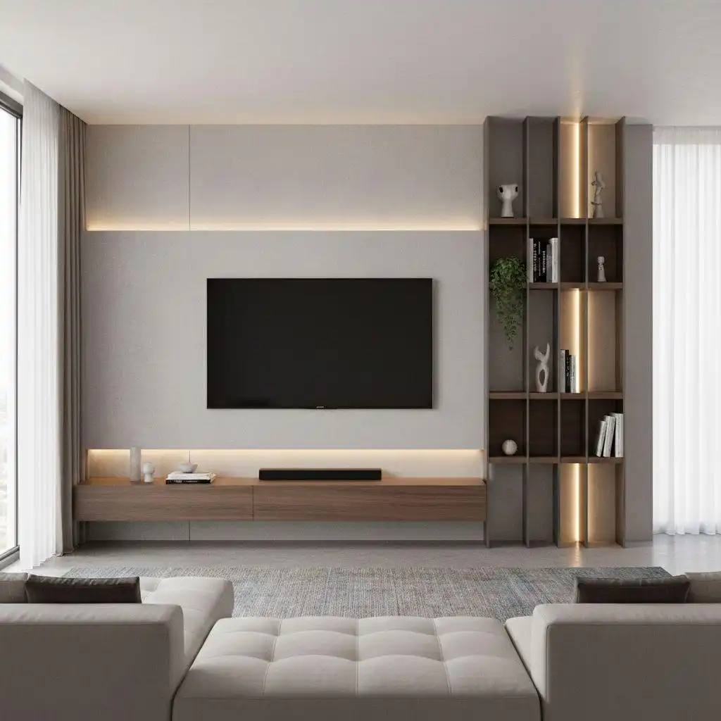 A minimalist TV wall featuring a grey floating panel with integrated LED backlighting, a wooden floating console, and a vertical open-shelf display.