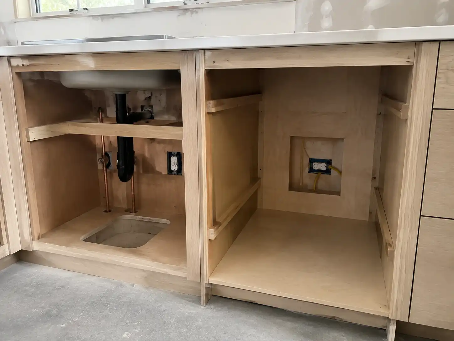 2a7c9923 b4bc 4e3a 9ee3 c203fb415bdd Custom kitchen cabinet openings coordinated with plumbing, electrical points, and appliance clearance.